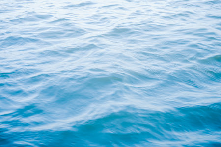 Blue sea water background. Texture of blue sea water surface with waves.の写真素材