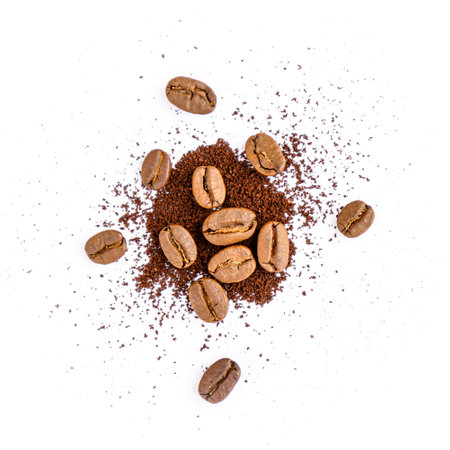 Coffee beans and ground coffee isolated on white background. Top view.の写真素材