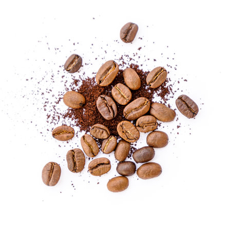 Coffee beans and ground coffee isolated on white background. Top view.の写真素材