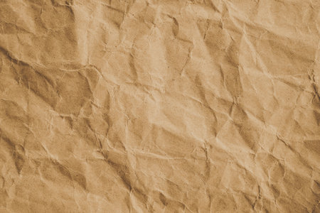 Crumpled brown paper texture background for design with copy space for text or image.の写真素材