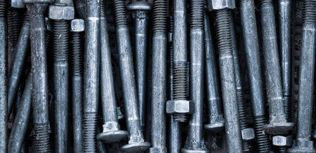 Screws and nuts background. Close up of bolts and nutsの写真素材