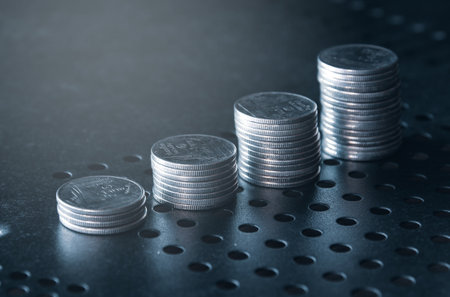 Stack of coins on black background, business and finance concept idea.の写真素材