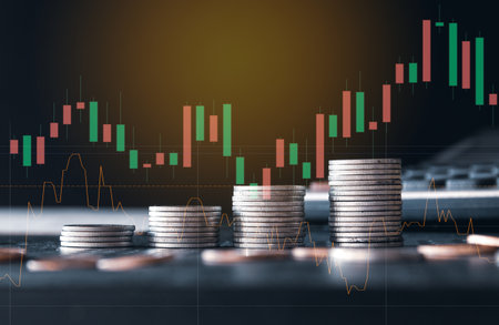 Double exposure of coin stacks and stock market graph background. Concept of financial and trading.の写真素材
