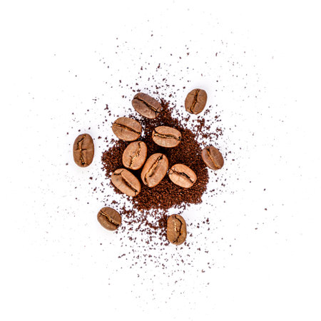 Coffee beans and ground coffee isolated on white background. Top view.の写真素材