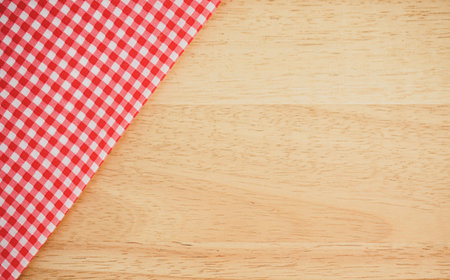 Red checkered tablecloth on wooden table background - Vintage Filterの写真素材