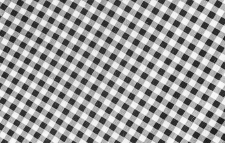 Texture of black and white checkered tablecloth for background.の写真素材