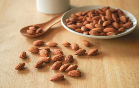 Almond on wooden background, Almond is a healthy food.の写真素材