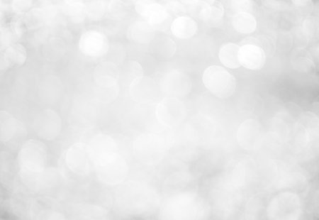 Silver bokeh background, abstract texture for Christmas and New Year.の写真素材