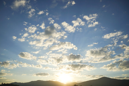 beautiful sunset in the mountains with clouds and blue sky, nature seriesの写真素材