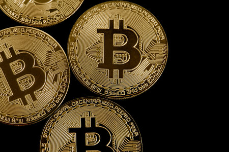 Bitcoin. Cryptocurrency. Golden bitcoins on a black background.の写真素材