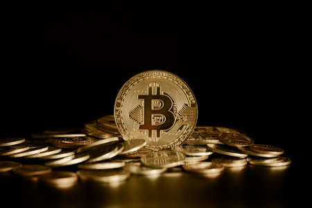 Golden bitcoin on black background. Digital currency. Cryptocurrency.の写真素材