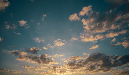 Beautiful sky with clouds at sunset. Natural background. Toned.の写真素材