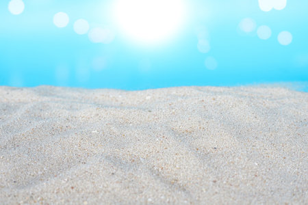 close up of sand on blue background with bokeh light effectの写真素材