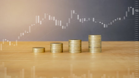 Investment concept, Coins graph stock market on wooden table and whiteboard background.の写真素材