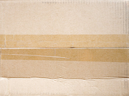 Cardboard box texture with natural fiber parts, used as background.の写真素材
