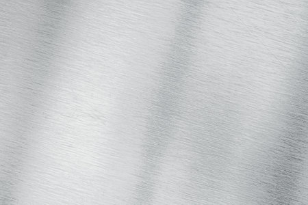 Metal background or texture of brushed steel plate with reflections Iron plate and shiny