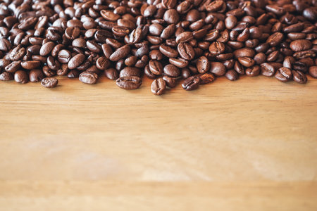 Coffee beans on wooden background with copy space for text.の写真素材