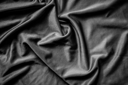 Texture of black satin fabric as background, top view. Space for textの写真素材