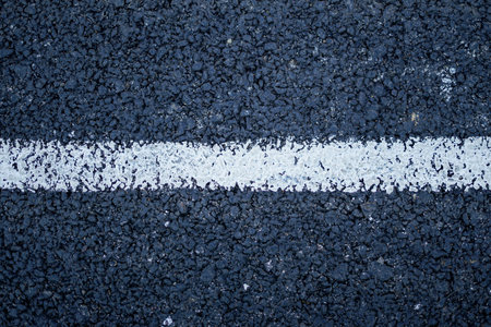 Asphalt texture with white line on the road. Abstract background for design.の写真素材