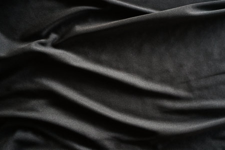 Black satin fabric texture background. Top view. Copy space.の写真素材