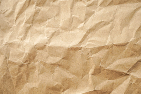Crumpled brown paper texture background for design with copy space for text.の写真素材