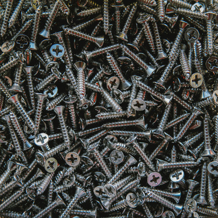 Screws background. Closeup of a pile of screws.の写真素材