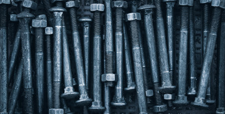 Metal bolts and nuts closeup. Industrial background. Toned.の写真素材