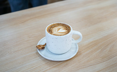 Coffee cup on wooden table in coffee shop, stock photoの写真素材