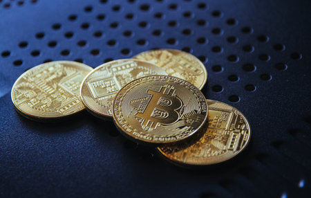 Golden bitcoins on a dark background close up. Cryptocurrency conceptの写真素材