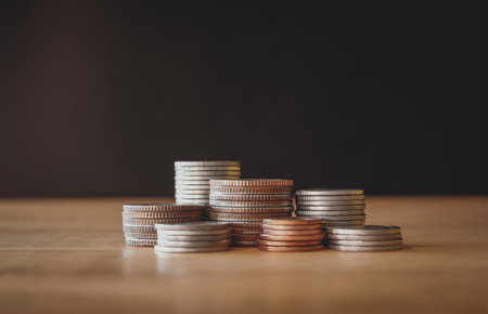 Coins stacked on each other in different positions. Money concept.の写真素材