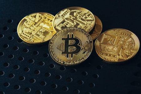 Golden bitcoin on a dark background. Cryptocurrency. Digital money.の写真素材