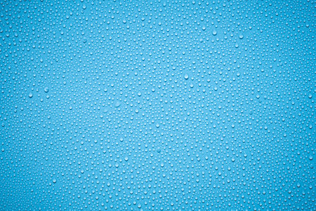 Water drops on blue background. Water drops on blue background. Water drops textureの写真素材