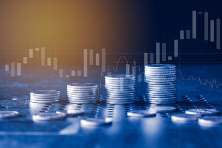 Double exposure of coin stack and graph stock market or forex trading and investment concept.の写真素材