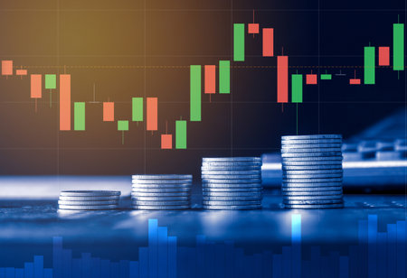 Coins stacked on each other with stock market chart background, business growth conceptの写真素材