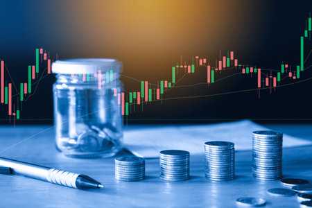 Investment concept, Coins graph stock market financial on table background.の写真素材