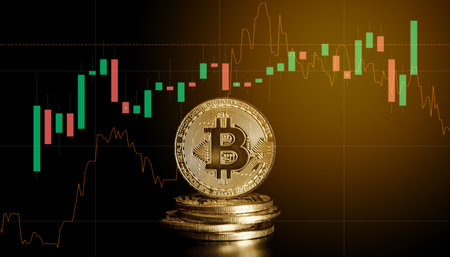 Bitcoin on the background of the candlestick chart. Cryptocurrency concept.の写真素材