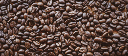 Coffee beans on wooden background, can be used as a backgroundの写真素材