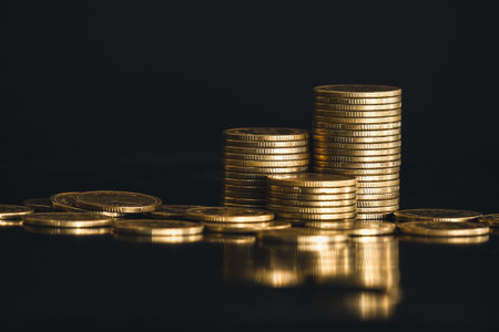Stacks of coins on black background, business and finance concept idea.の写真素材