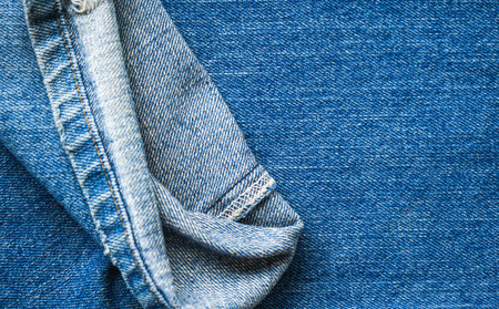 Denim texture or denim jeans background with seam of fashion jeans design and copy space for text or...