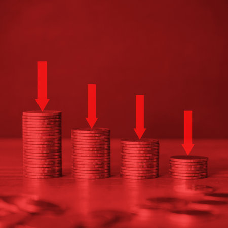 Stacks of coins with red arrow on red background. Financial growth concept.
