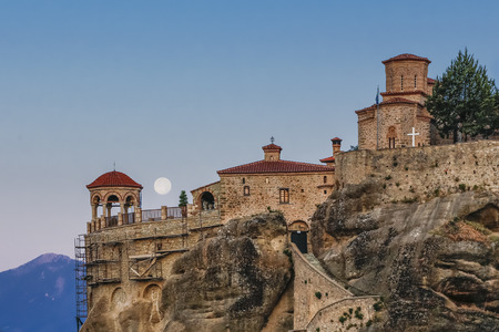 Full moon setting over Varlaam Monastry, Meteora, Greece