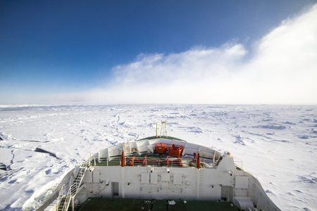 Frozen polar sea and vast ice floes from the bridge of a research icebreaker ship