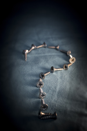 Pile of Screws Question Markの写真素材