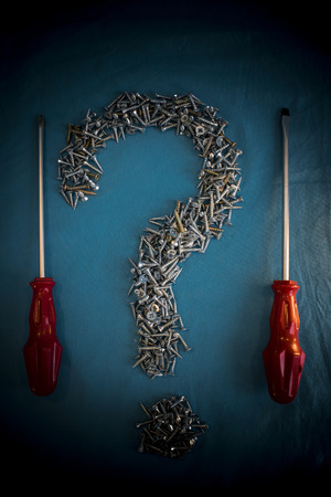 Screw Question Mark and Screwdriversの写真素材