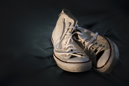 Two different sneakers as a symbol of Couple in Loveの写真素材