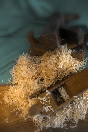 Pile of sawdust with three plane hand toolsの写真素材