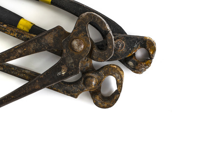 Close-up view of three layers of rusty pincer pliersの写真素材