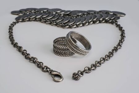 Coin Jewelry in Shape of Heart with Wedding Ringsの写真素材