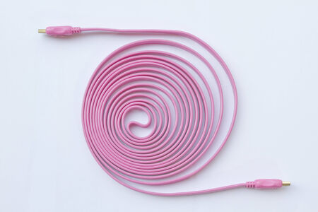 pink tech cable with plug isolated on a white backgroundの写真素材