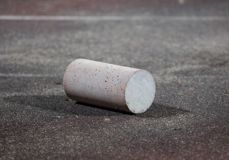 cement cylinder on floorの写真素材